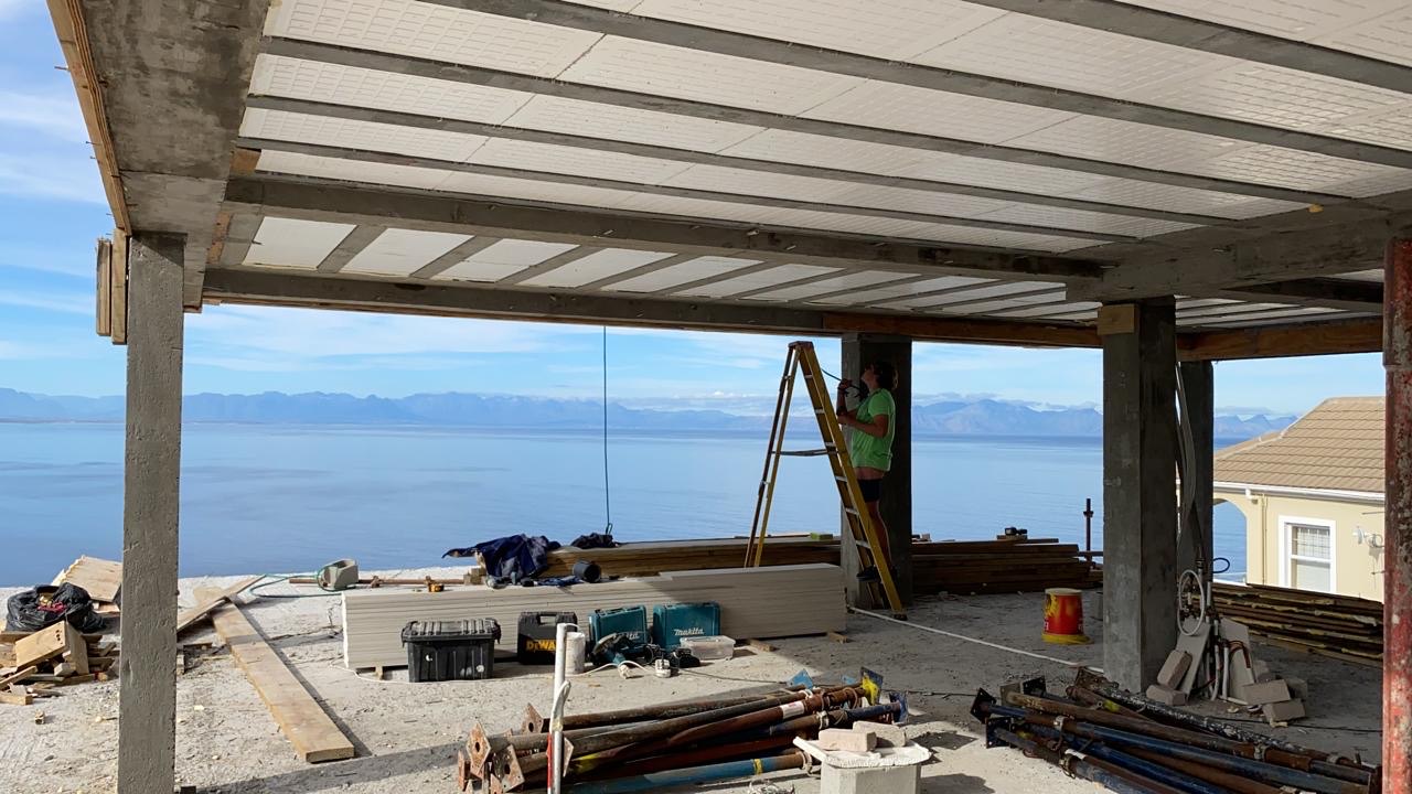 Concrete structure of a hybrid build going up above the bay
